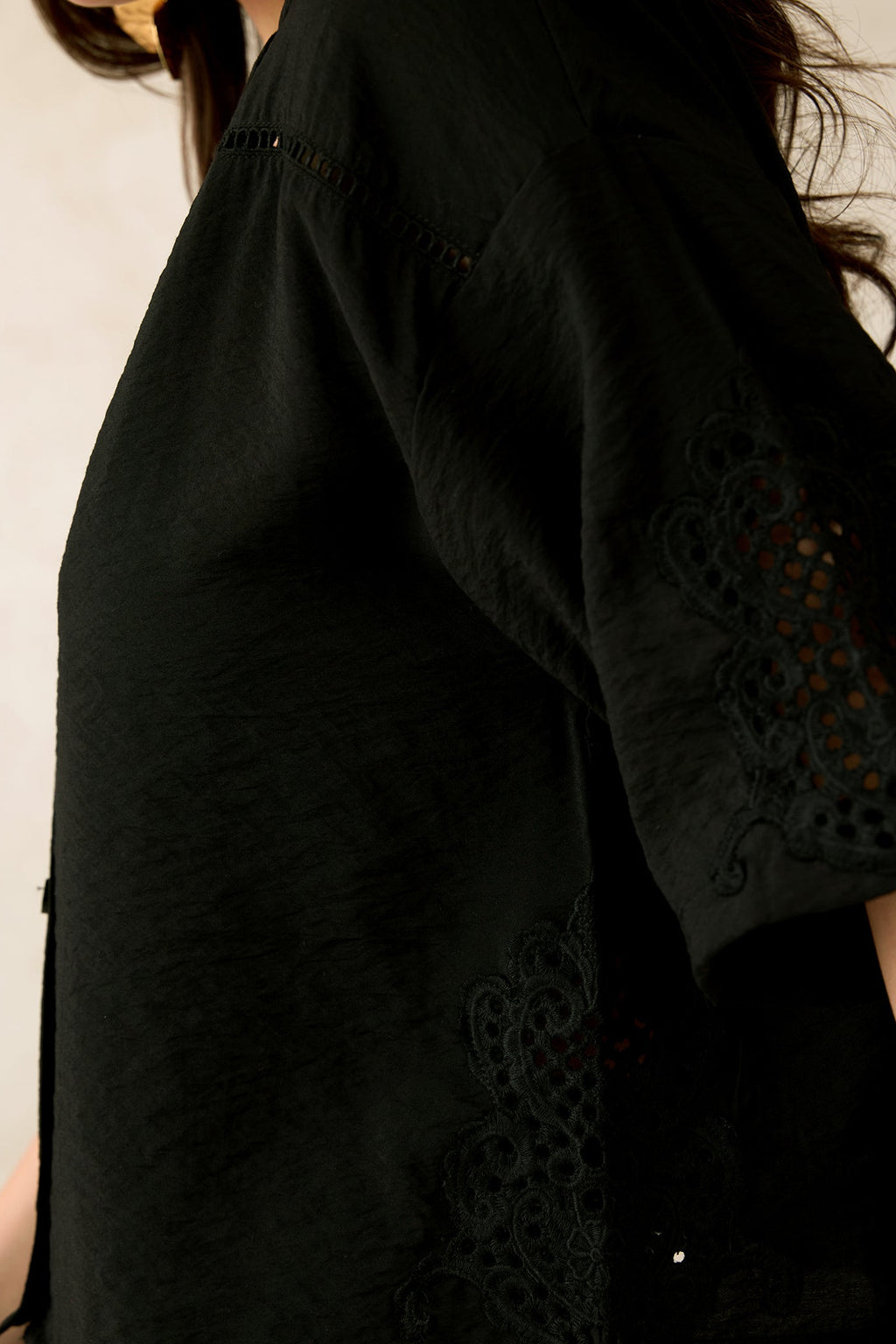 Women's black summer shirt with intricate lace detailing on sleeves for a stylish look