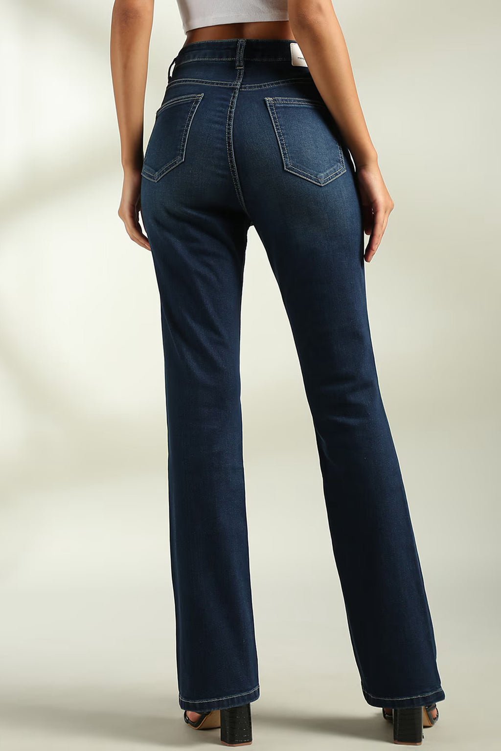 Dark blue women's bootcut jeans India featuring a flattering fit and stylish pocket design