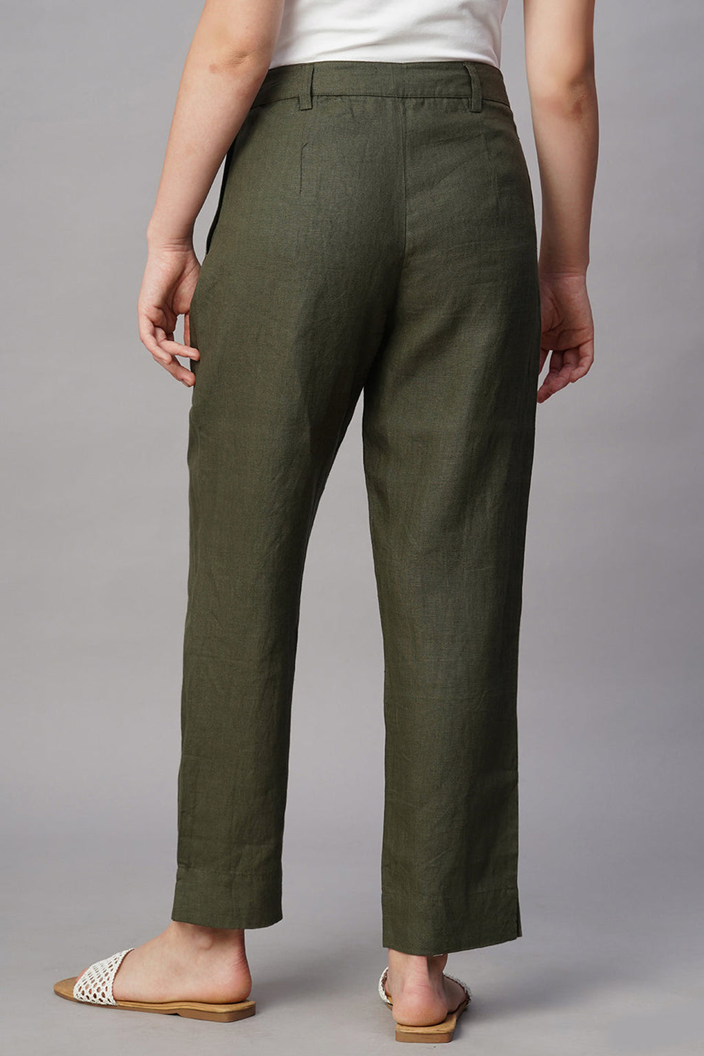 Back view of women's chic linen pants in olive green, featuring a tailored fit and breathable fabric