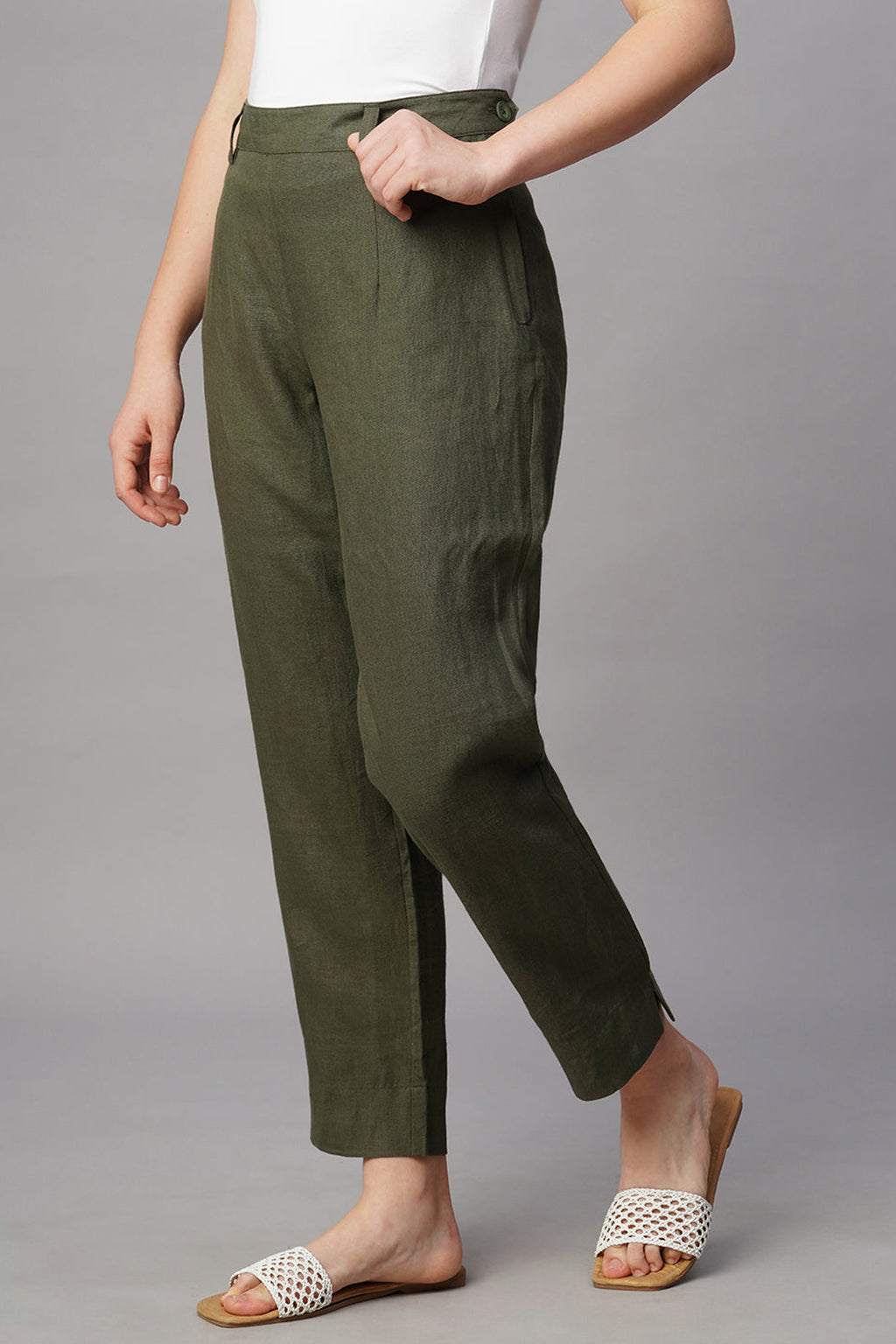 Stylish women's chic linen pants in olive green with a tailored fit and side pockets