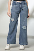 Women's distressed wide-leg jeans in light blue with trendy rips and relaxed fit