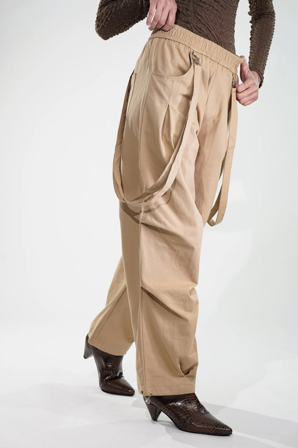 Beige women's fashion cargo pants with adjustable straps for a stylish and comfortable fit