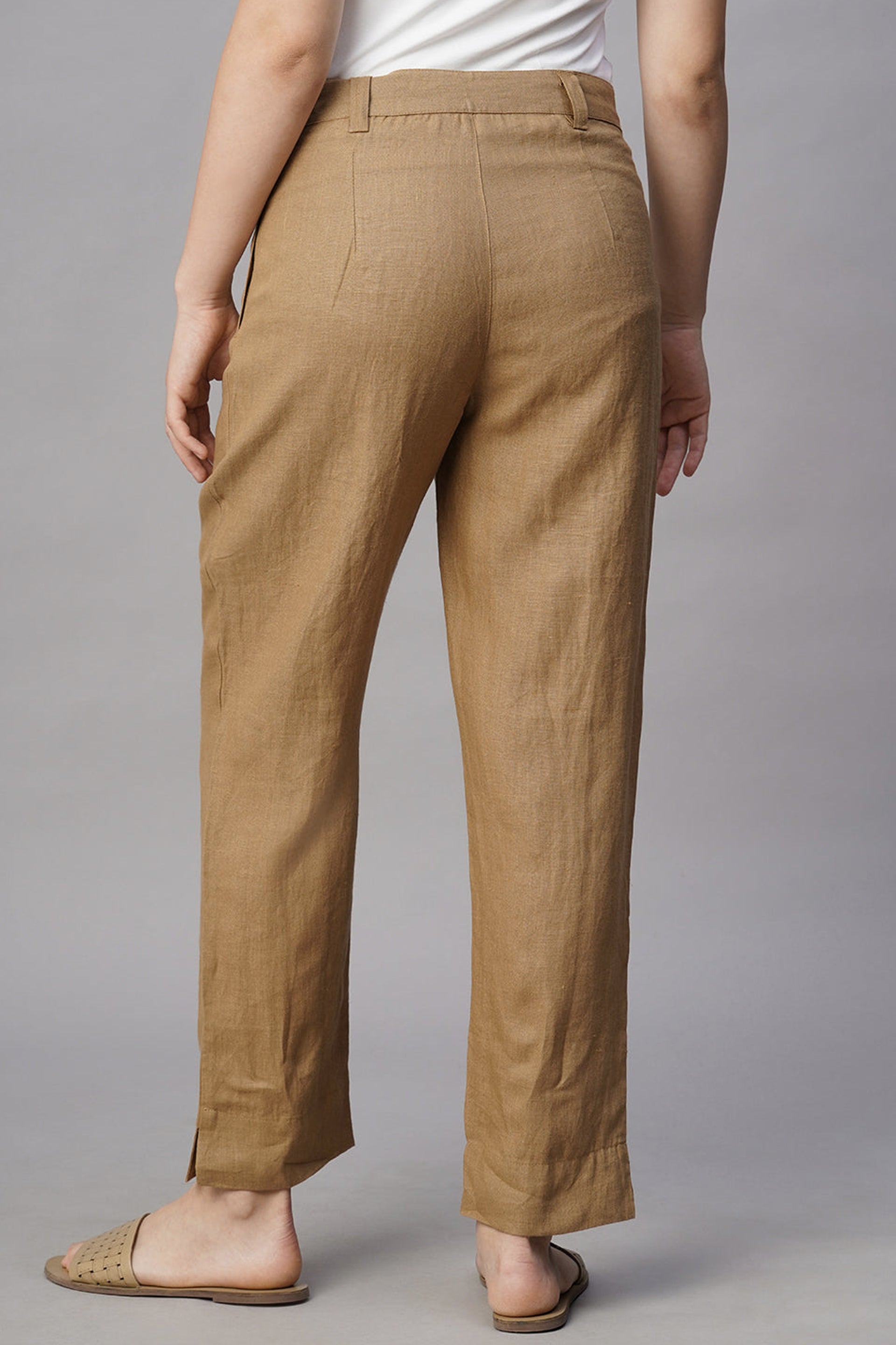 Back view of women's khaki linen pants featuring a comfortable fit and stylish design