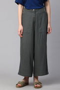 Comfortable dark green women's linen culottes with a relaxed fit and button closure