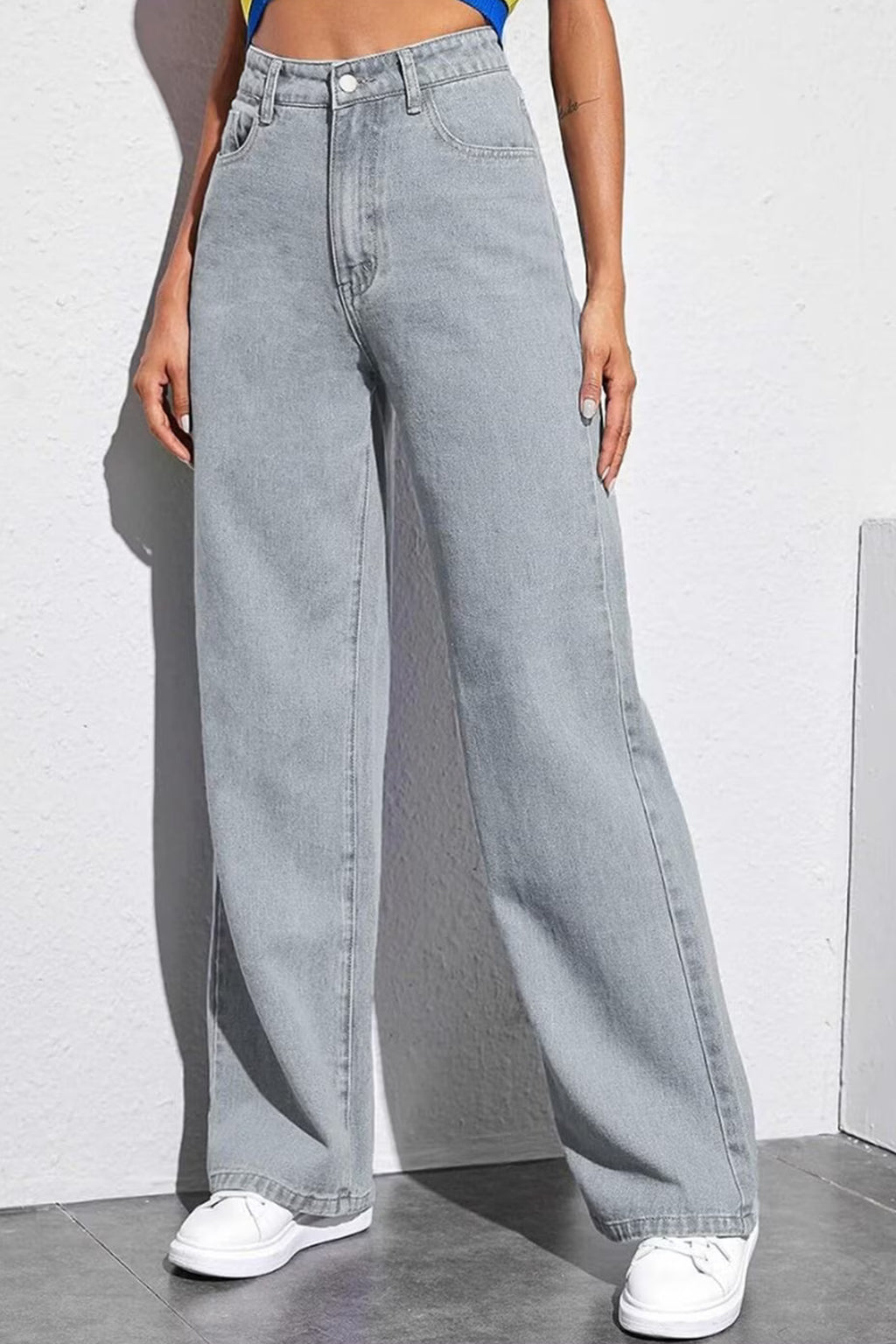 Stylish women's mid-rise grey jeans with a wide-leg fit for a modern casual look