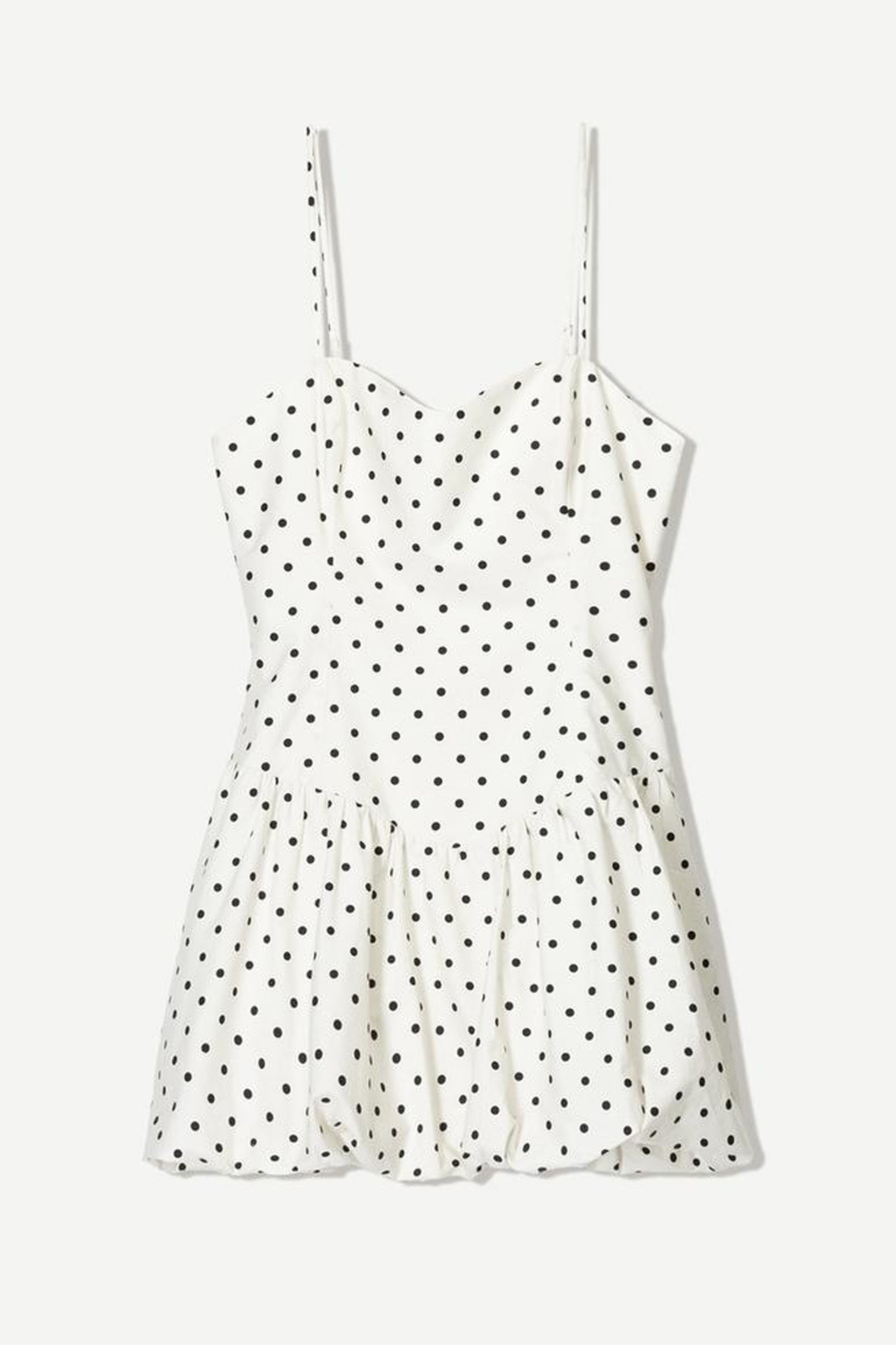 Women's polka dot summer dress in white with black dots and flared hem for a stylish look