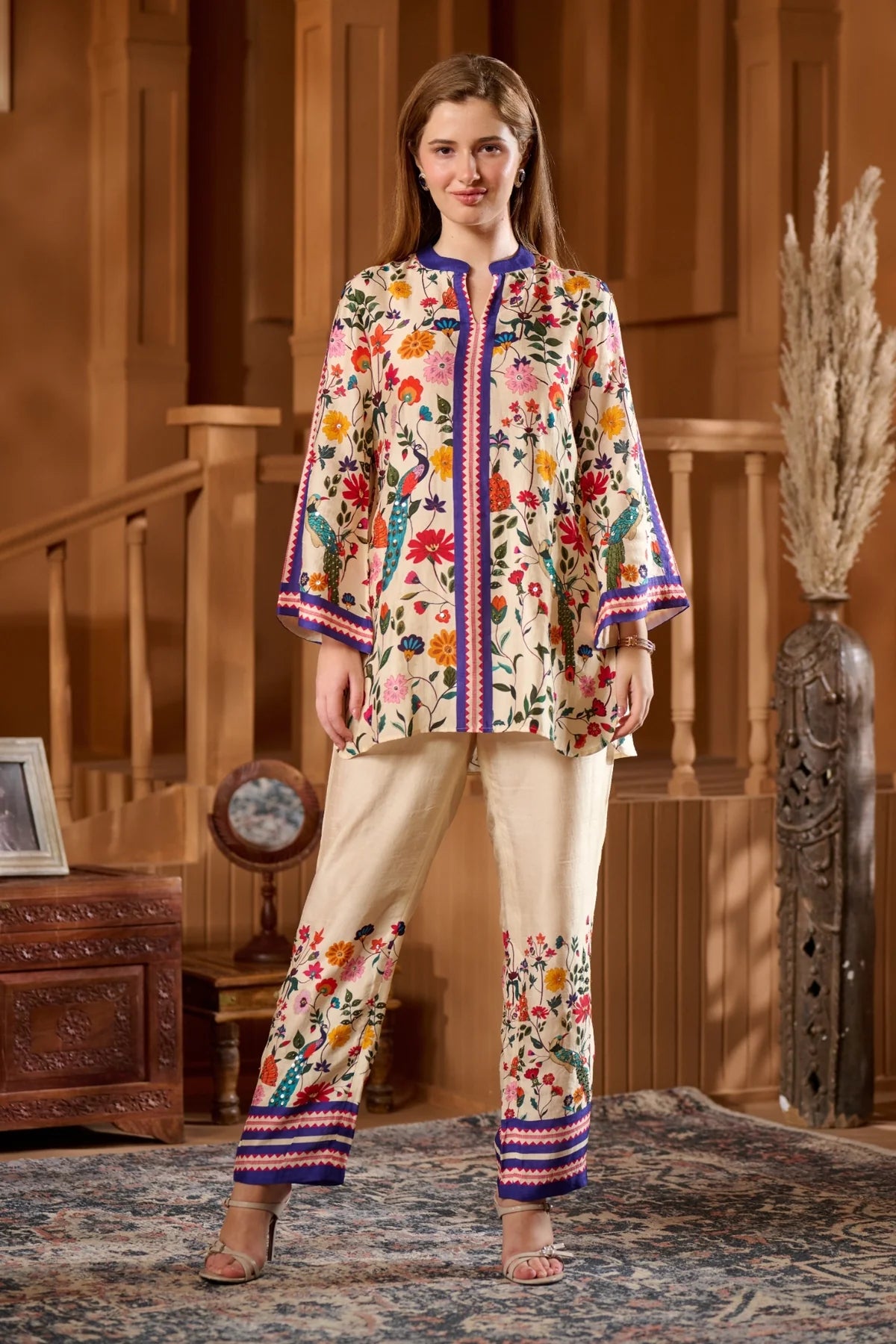 Women's Raw Silk Ethnic Wear Online featuring a Colorful Floral Kurta with Matching Pants
