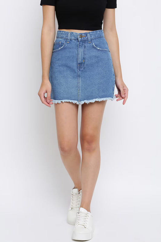 Women's solid denim skirt in light blue with frayed hem and front pockets from Dirtylabels