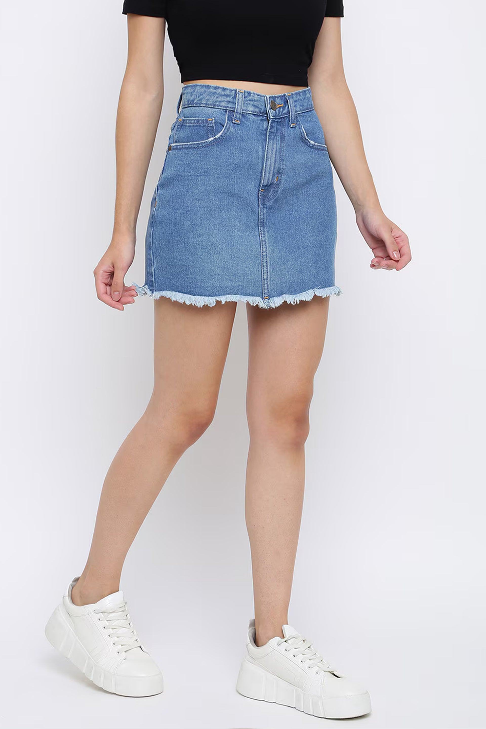 Dirtylabels women's solid denim skirt in light blue with a fringed hem and a fitted silhouette