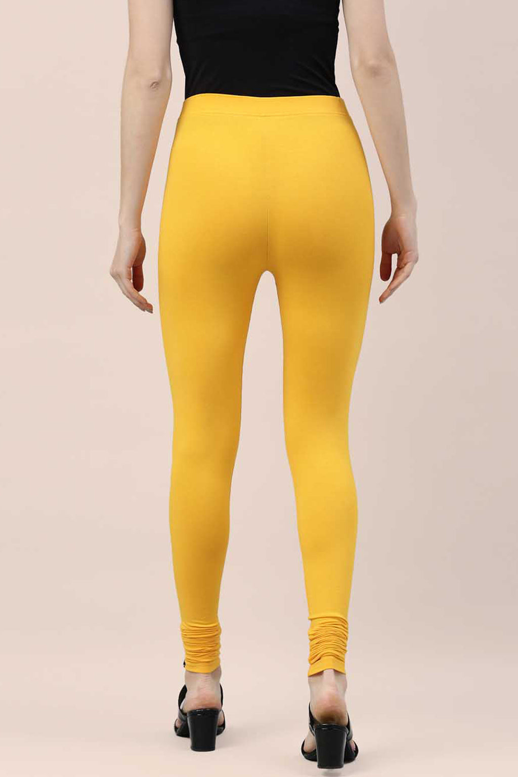 Back view of yellow cotton ankle leggings by Dirtylabels, perfect for casual wear and comfort